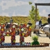 Dappled gray horse cantering past a SHP water feature in the Grand Prix arena.